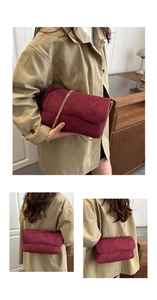 Detailed views of burgundy suede crossbody bag with premium gold chain strap highlights