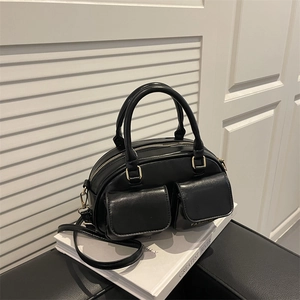 Elegant black Boston style handbag with magnetic flap pockets and gold hardware