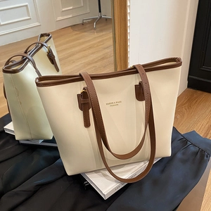 Minimalist large capacity tote bag with cream leather body and brown shoulder straps