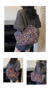 Detail shots of large leopard print tote bag with black straps and metallic accents