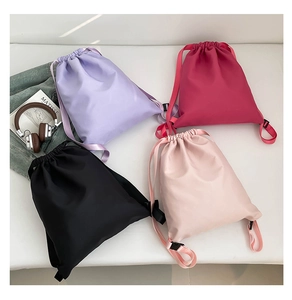 Selection of lightweight waterproof nylon drawstring backpacks in four diverse vibrant colors