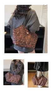 Detail of leopard print tote bag with long leather straps and gold metal twist lock