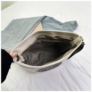 Internal view of cream white tote bag showing spacious compartment and zipper pocket