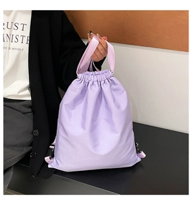 Detail view of the light purple waterproof drawstring backpack with adjustable straps