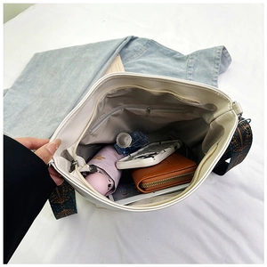 Interior view of white PU tote bag showing large capacity with ethnic print strap