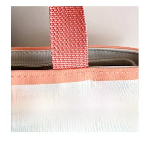 Close-up of durable tote bag handles with neat stitching and a secure top zipper closure