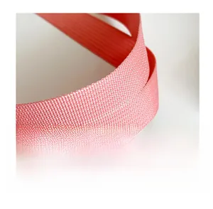 Close-up of the woven nylon handle on the pink tote bag showing the fine fiber texture