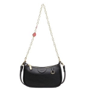 Vintage black pebble leather pillow bag with gold chain strap and pink strawberry charm