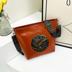 Vintage brown leather tote bag with elephant relief and bohemian wide shoulder strap