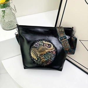 Retro black leather shoulder bag with elephant relief and ethnic style wide strap