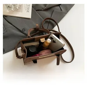 Top view of spacious dark brown suede tote bag showing interior storage for daily items