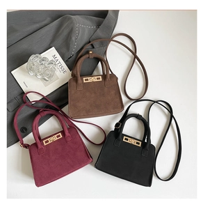 Three minimalist large-capacity tote bags in brown, burgundy, and black with gold buckles
