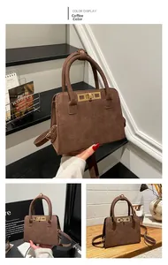 Detail of vintage brown matte tote bag with golden square buckle and suede texture