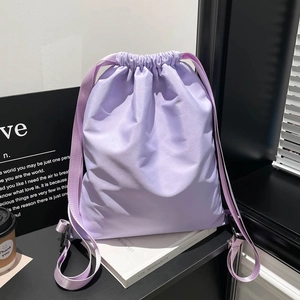 Elegant light purple drawstring backpack with wide straps for travel and daily commute