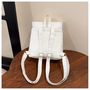 Rear view of white PU leather backpack showing adjustable straps and lace trim details