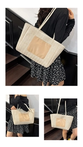 Detail of woven straw tote bag featuring beige texture and brown leather patch