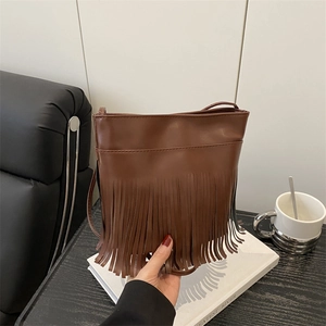 Vintage brown fringe crossbody bag with leather tassels in a stylish bohemian design