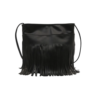 Minimalist black faux leather crossbody bag featuring long stylish vertical tassels