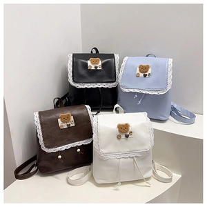 Mini backpack display in four colors featuring lace trim and cute bear ornaments
