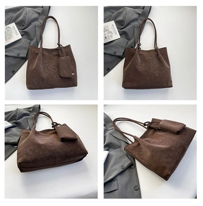 Detail of dark brown faux suede tote bag set with matching small zipper pouch and slim straps