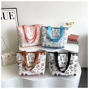 Detailed view of four colorful printed canvas tote bags with bear and star graffiti