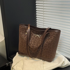 Brown leopard print large tote bag with dark straps and golden bow buckle detail