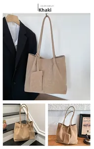 Detailed close-up of khaki faux suede tote bag with matching coin purse accessory