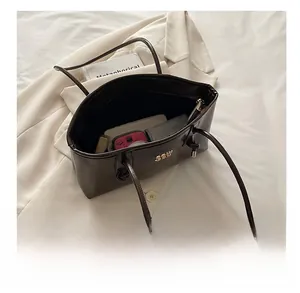 Deep brown large tote bag interior showing spacious storage for daily work essentials