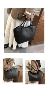 Detail of black lychee grain leather tote bag with dual straps for versatile carrying