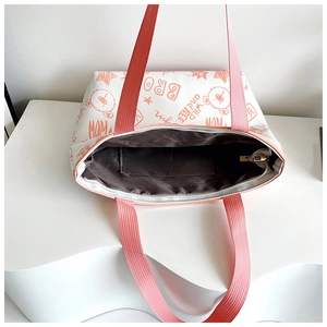Top view of large tote bag showing brown fabric lining with an internal pocket
