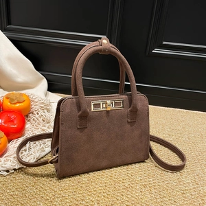 Vintage brown matte suede handbag with golden buckle lock and adjustable strap