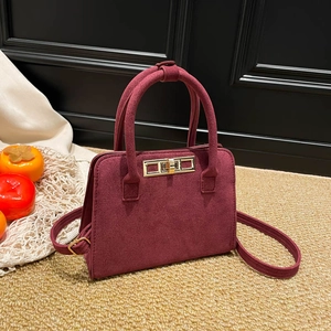Vintage burgundy matte handbag for women with gold clasp and top handle design
