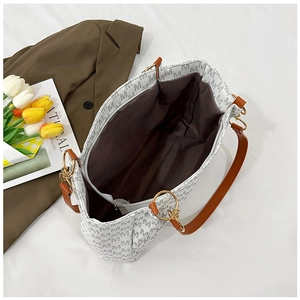 Top view of spacious interior with zipper pocket and gray M-letter print tote bag