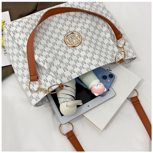 Interior view of large tote bag showing capacity for tablet, umbrella and phone