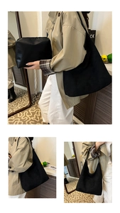 Detail of black matte leather tote bag and matching inner pouch set in casual setting