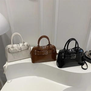 Minimalist patent leather shell handbag in white, brown and black with belt buckle detail