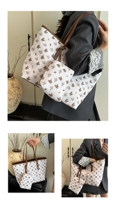 Detail of printed tote bag and mini pouch set featuring Pegasus patterns and leather trim