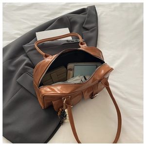 Detailed top view of a brown vintage PU tote bag showing large capacity for daily items