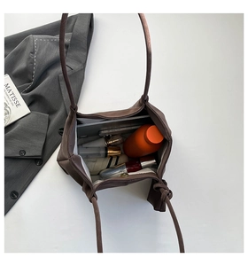Top view of large tote bag showing interior storage with water bottle and tablet