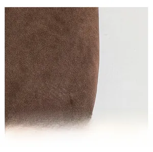 Detailed macro view of high-quality dark brown suede texture on this tote bag
