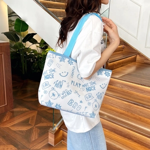 Minimalist large-capacity white canvas tote bag with blue graffiti bear print