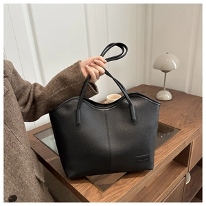 Classic black litchi leather tote bag with embossed logo for stylish office commuting
