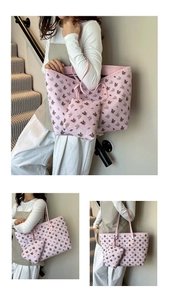 Detail of pink tote bag set with pegasus print including a small matching zipper pouch