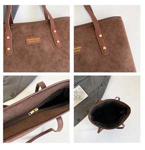Detail view of brown suede tote bag with golden rivets and metal zipper closure