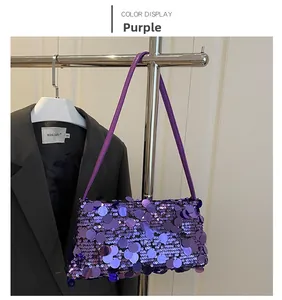 Detail of purple sequin crossbody bag showing metallic texture and glitter on shoulder strap