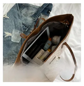 Detail view of large printed tote bag interior showing capacity for daily essentials
