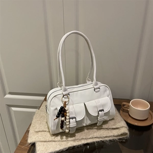 Minimalist white high-gloss Boston bag with utility pockets and beaded charm detail