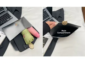 Detailed interior of silver metallic envelope bag showing capacity for phone and umbrella