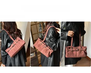 Detailed views of brown suede underarm bag featuring vintage metal buckle and belt design