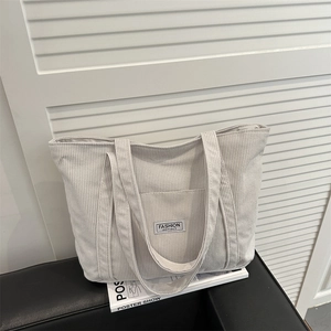 Minimalist beige corduroy tote bag with front pocket for stylish autumn commuting